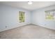 Calming bedroom with soft blue walls, carpet, and natural light at 2104 Stoneyridge Dr, Charlotte, NC 28214