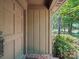 The front door features a charming entryway, tile accents, and a green shrub at 2104 Stoneyridge Dr, Charlotte, NC 28214