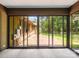 The screened porch overlooks a brick patio and a spacious, green backyard at 2104 Stoneyridge Dr, Charlotte, NC 28214