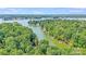Aerial view of waterfront properties nestled among lush green trees along the shoreline at 2116 Bon Villa Way, Fort Mill, SC 29708