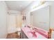 Modest bathroom with a shower-tub combo, pink sink, and matching countertop at 2116 Bon Villa Way, Fort Mill, SC 29708