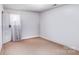 Bright bedroom with tan carpet and neutral-colored walls at 2116 Bon Villa Way, Fort Mill, SC 29708
