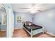 Comfortable bedroom with blue walls, wood-look floors, closet, and a ceiling fan at 2116 Bon Villa Way, Fort Mill, SC 29708