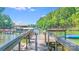 Lake view from a wooden dock on the water with a covered boat slip at 2116 Bon Villa Way, Fort Mill, SC 29708