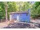 Charming blue two-story home with a fenced yard and mature trees, offering privacy and curb appeal at 2116 Bon Villa Way, Fort Mill, SC 29708
