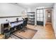 Office space with light walls, wood-look flooring, natural light, shelving, and a barn door at 2116 Bon Villa Way, Fort Mill, SC 29708