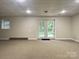 Finished basement with carpet, french doors leading to the exterior, and a large window at 228 31St Avenue Ne Ct, Hickory, NC 28601