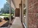Covered porch with brick accents, offering a welcoming entry and classic architectural details at 228 31St Avenue Ne Ct, Hickory, NC 28601