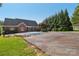 Brick home with pool, lawn and privacy landscaping at 2411 Stoney Run Dr # 13, Oakboro, NC 28129
