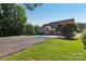 Home's backyard with pool, lawn and privacy landscaping at 2411 Stoney Run Dr # 13, Oakboro, NC 28129