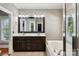 Bathroom with a double sink, soaking tub, and shower creating a comfortable and functional space at 2411 Stoney Run Dr # 13, Oakboro, NC 28129