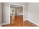 Bedroom with hardwood floors and abundant natural light beaming through the open entry way at 2411 Stoney Run Dr # 13, Oakboro, NC 28129