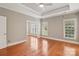 This bedroom offers generous space, tray ceilings, and multiple windows for ample natural light at 2411 Stoney Run Dr # 13, Oakboro, NC 28129