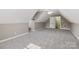 Bright bonus room with neutral carpet and natural light at 2411 Stoney Run Dr # 13, Oakboro, NC 28129