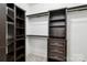 Walk-in closet with shelving, drawers and hanging rods providing great organization and storage capabilities at 2411 Stoney Run Dr # 13, Oakboro, NC 28129
