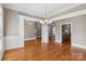 Formal dining room showcasing hardwood floors, elegant chandelier, and classic molding details at 2411 Stoney Run Dr # 13, Oakboro, NC 28129