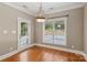 Bright dining area with hardwood floors and natural light overlooking the pool at 2411 Stoney Run Dr # 13, Oakboro, NC 28129