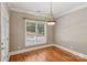 Bright dining area with hardwood floors and natural light overlooking the pool at 2411 Stoney Run Dr # 13, Oakboro, NC 28129