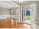 Open foyer featuring hardwood floors, decorative columns, and an open view of the front yard at 2411 Stoney Run Dr # 13, Oakboro, NC 28129