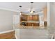 The kitchen features granite countertops, wood cabinets, and a breakfast bar area at 2411 Stoney Run Dr # 13, Oakboro, NC 28129