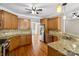 Well-equipped kitchen featuring granite counters, stainless steel appliances, and wood cabinetry at 2411 Stoney Run Dr # 13, Oakboro, NC 28129