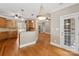 Open kitchen with stainless steel appliances, granite counters, and hardwood flooring at 2411 Stoney Run Dr # 13, Oakboro, NC 28129