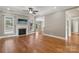 Bright living room with a fireplace, hardwood floors and smooth transition to other areas of the home at 2411 Stoney Run Dr # 13, Oakboro, NC 28129