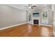 Cozy living room with a fireplace, neutral colors and hardwood floors for a warm and inviting atmosphere at 2411 Stoney Run Dr # 13, Oakboro, NC 28129
