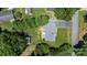 An aerial view shows a well-maintained property featuring mature trees, a detached shed and a driveway to the rear of the house at 2623 Ne 13Th Ne St, Hickory, NC 28601