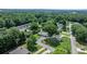 An aerial view of a charming home surrounded by lush greenery and mature trees in a peaceful neighborhood at 2623 Ne 13Th Ne St, Hickory, NC 28601