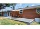 Cozy back patio with a brick exterior, gravel foundation, and outdoor seating area at 2623 Ne 13Th Ne St, Hickory, NC 28601
