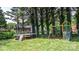 Grassy backyard featuring a trampoline and a swing set, providing hours of fun and entertainment at 2623 Ne 13Th Ne St, Hickory, NC 28601