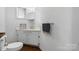 Clean, simple bathroom featuring a white vanity and classic fixtures at 2623 Ne 13Th Ne St, Hickory, NC 28601