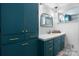 Stylish bathroom features custom teal cabinetry and modern fixtures at 2623 Ne 13Th Ne St, Hickory, NC 28601