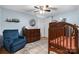Comfortable Bedroom featuring a crib, dresser, and soft, blue color palette at 2623 Ne 13Th Ne St, Hickory, NC 28601