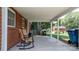 Relaxing covered patio with comfortable rocking chairs and serene backyard views at 2623 Ne 13Th Ne St, Hickory, NC 28601