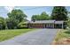 Well-maintained brick home with a lush green lawn, classic design and a paved driveway with parking at 2623 Ne 13Th Ne St, Hickory, NC 28601