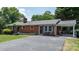 Charming brick home with a well-maintained lawn, tasteful front yard landscaping and attached carport at 2623 Ne 13Th Ne St, Hickory, NC 28601