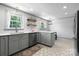 Well-lit kitchen with gray cabinetry and stainless steel appliances at 2623 Ne 13Th Ne St, Hickory, NC 28601