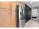 Bright kitchen showcasing stainless steel refrigerator and ample wood cabinetry at 2623 Ne 13Th Ne St, Hickory, NC 28601