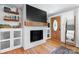 Cozy living room with fireplace, custom built-ins, and hardwood floors at 2623 Ne 13Th Ne St, Hickory, NC 28601