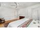 Bedroom featuring white walls, crown molding, hardwood floors, and multiple doors at 2825 Sharon View Rd, Charlotte, NC 28210
