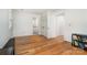 Bedroom with hardwood floors, a view to the ensuite bathroom, and a closet at 2825 Sharon View Rd, Charlotte, NC 28210