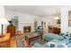 Cozy living room with a brick fireplace and hardwood floors at 2825 Sharon View Rd, Charlotte, NC 28210