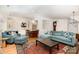 Comfortable living room featuring hardwood floors and an open layout to the kitchen at 2825 Sharon View Rd, Charlotte, NC 28210