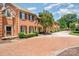Beautiful brick townhomes with well-maintained landscaping along a brick-paved street at 2825 Sharon View Rd, Charlotte, NC 28210