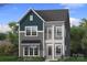 Charming two-story home showcasing a modern design with a covered front porch and a mix of siding textures at 3119 Middle St # 94, Charlotte, NC 28278