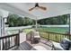 Covered porch with a beautiful outdoor entertaining area and lush backyard views at 333 Anne Ave, Waxhaw, NC 28173
