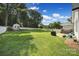Expansive backyard featuring a lush green lawn, fenced perimeter, and stone patio at 333 Anne Ave, Waxhaw, NC 28173
