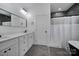 Modern bathroom with double sink, granite countertops, and sleek black fixtures at 333 Anne Ave, Waxhaw, NC 28173